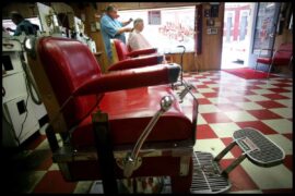 Barber chairs with red upholstery inside the Anna Lamar Switzer Center for Visual Arts.
