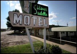 Clever Saddle Motel sign with neon lights in Pensacola.