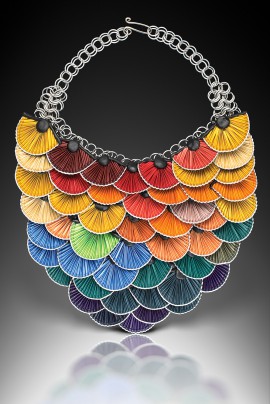 Rainbow fan-shaped layered necklace with vibrant colors and metallic chain.